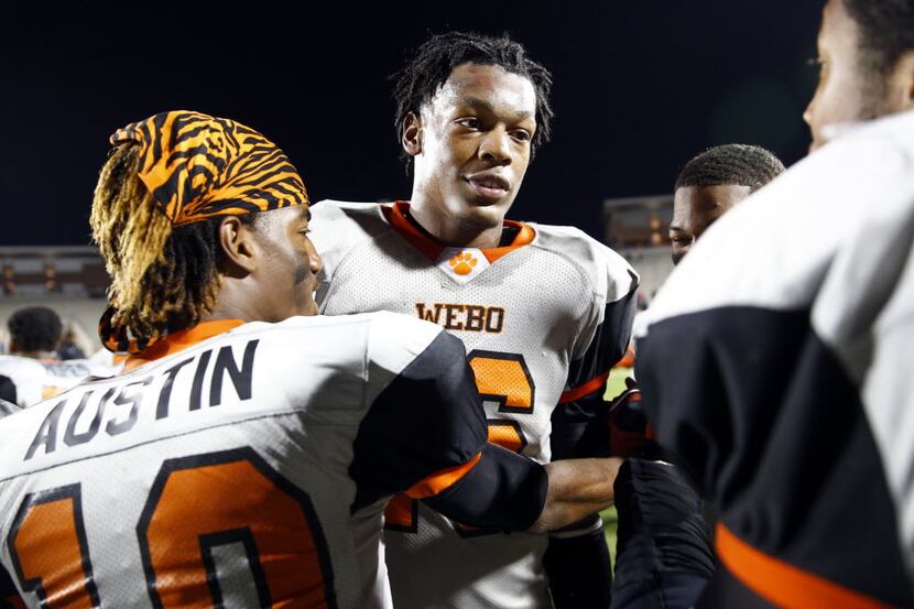 Lancaster's defensive lineman Daeshon Hall (16) begins to celebrate with teammates om their...