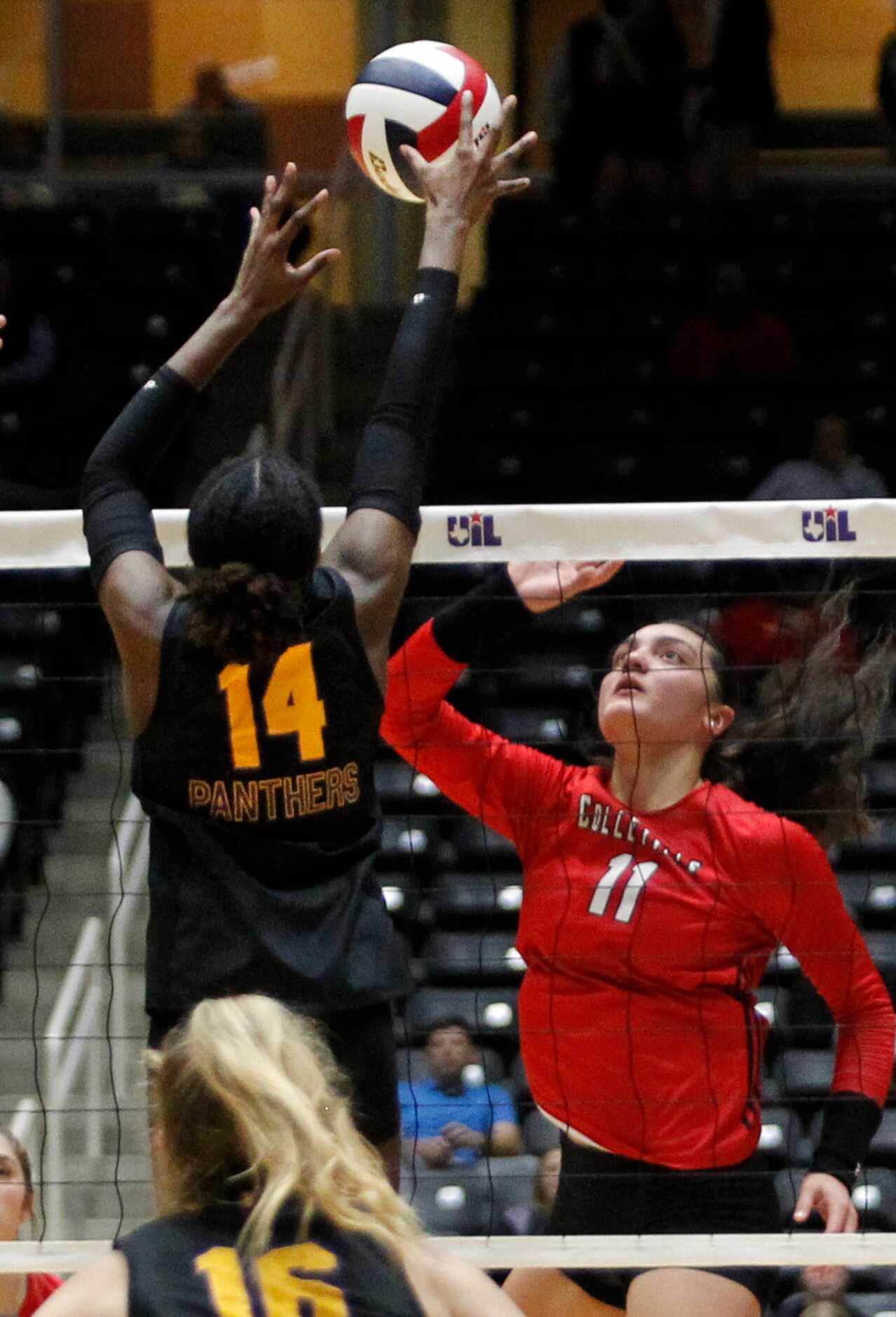 Colleyville Heritage junior Suli Davis (11), right, follows a shot against the defense of...