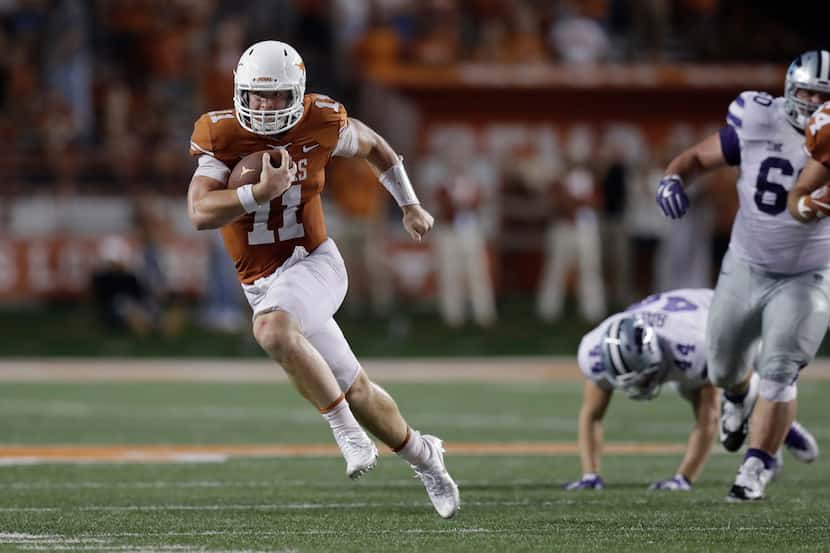 Texas quarterback Sam Ehlinger (11) runs for 15 yards against Kansas State during the second...