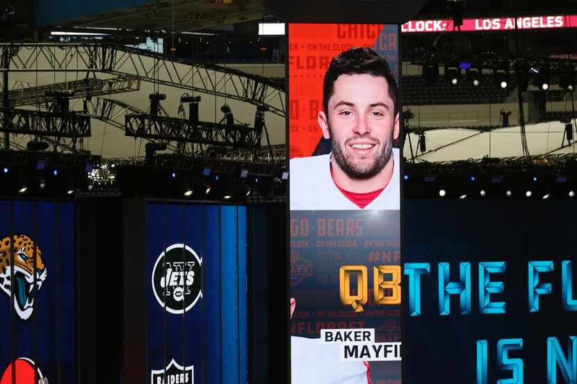 A photograph of Oklahoma quarterback Baker Mayfield is displayed inside of AT&T Stadium as...