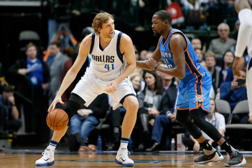 Dallas Mavericks forward Dirk Nowitzki (41) moves the ball to the basket as Oklahoma City...