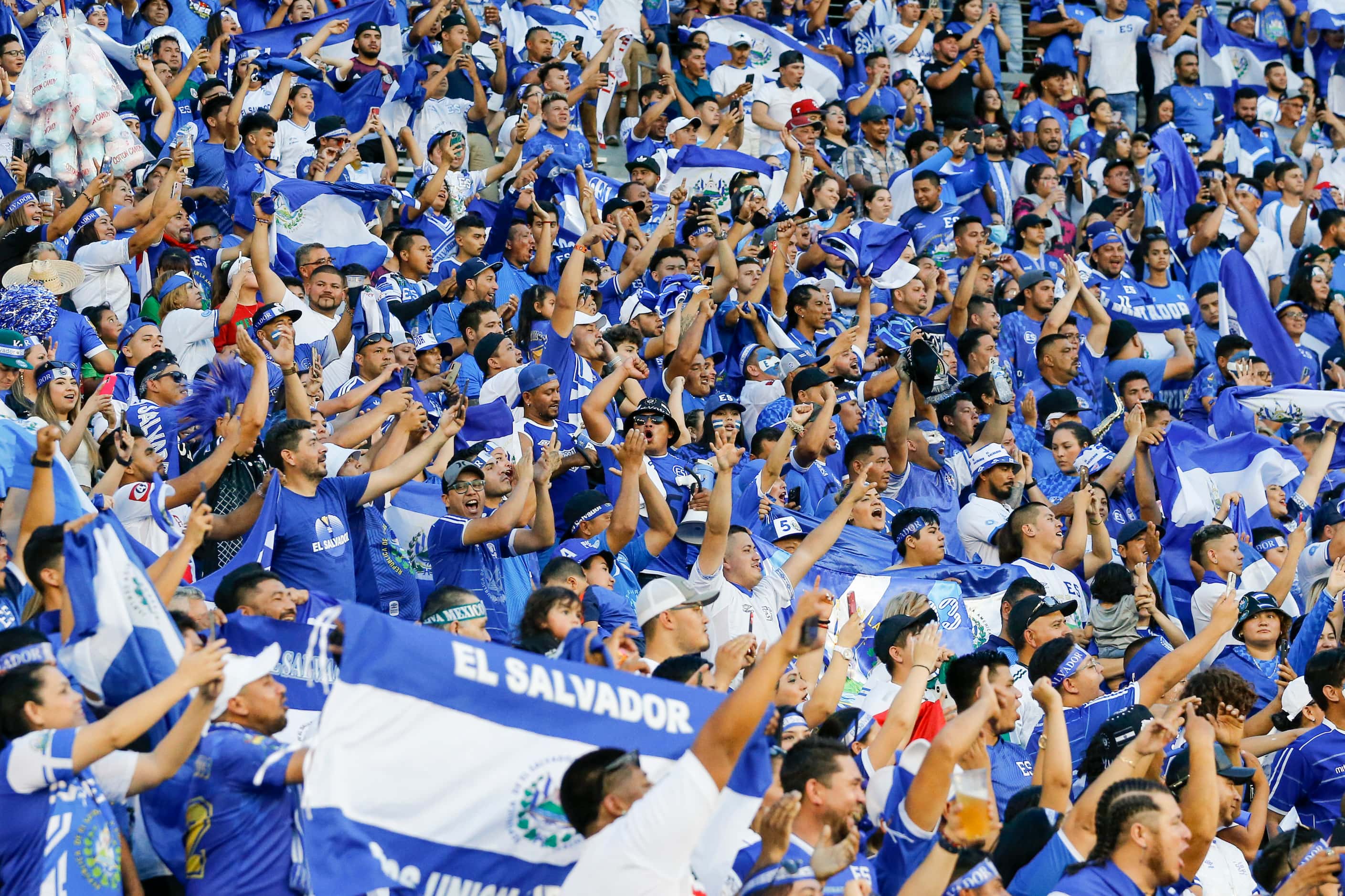 Fans of El Salvador cheer as the team walks onto the field before the first half of a...