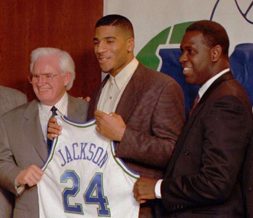 Dallas Mavericks owner Donald Carter, left, poses with first round draft pick Jim Jackson,...