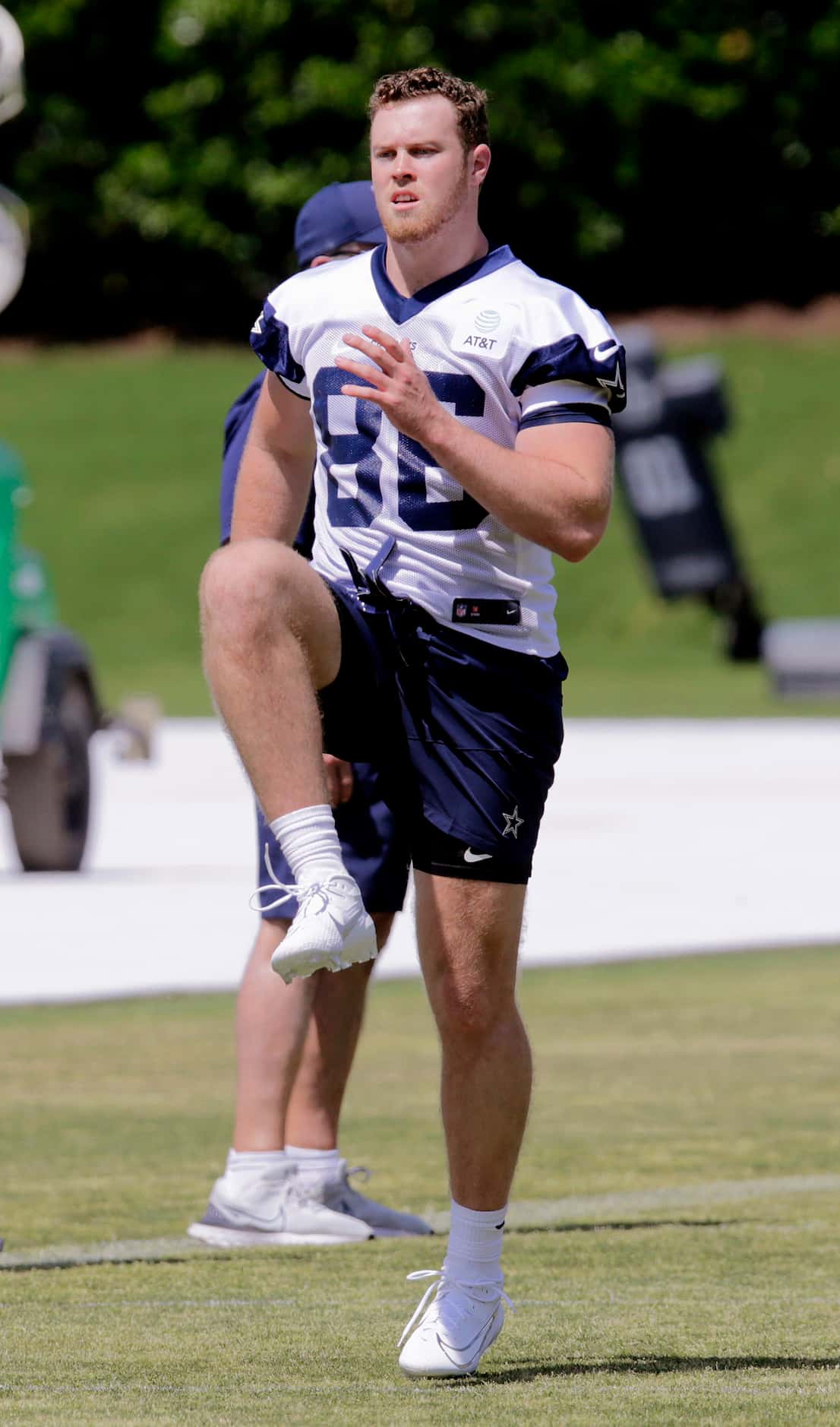 Cowboys rookie tight end Luke Schoonmaker (86) stretches out before drills as the Dallas...