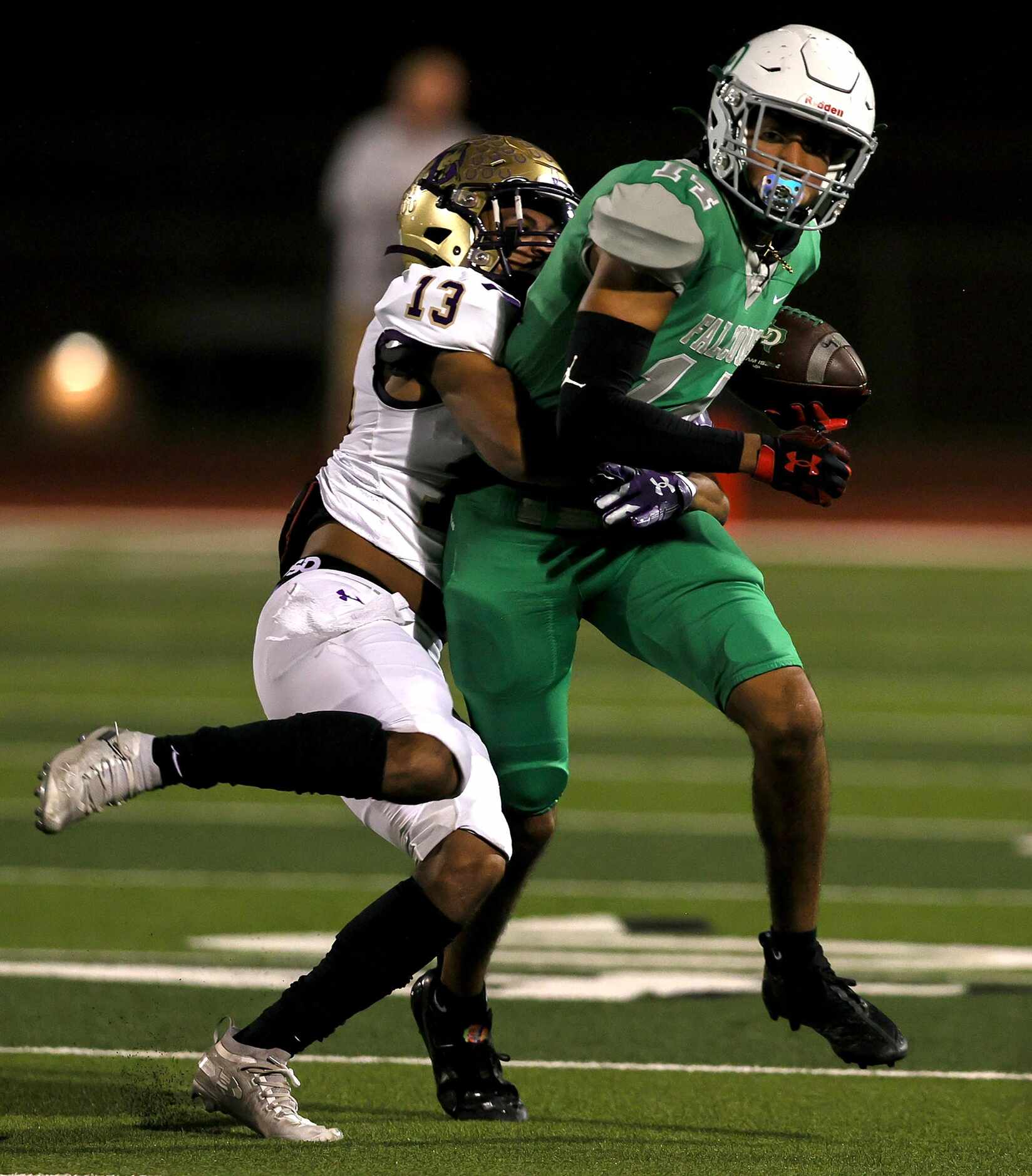 Lake Dallas wide receiver Evan Weinberg (14) comes up with a reception against Denton safety...