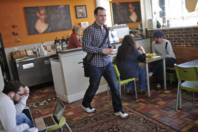 Peter Donkin walks away from the counter at Murray Street Coffee Shop in Deep Ellum after...