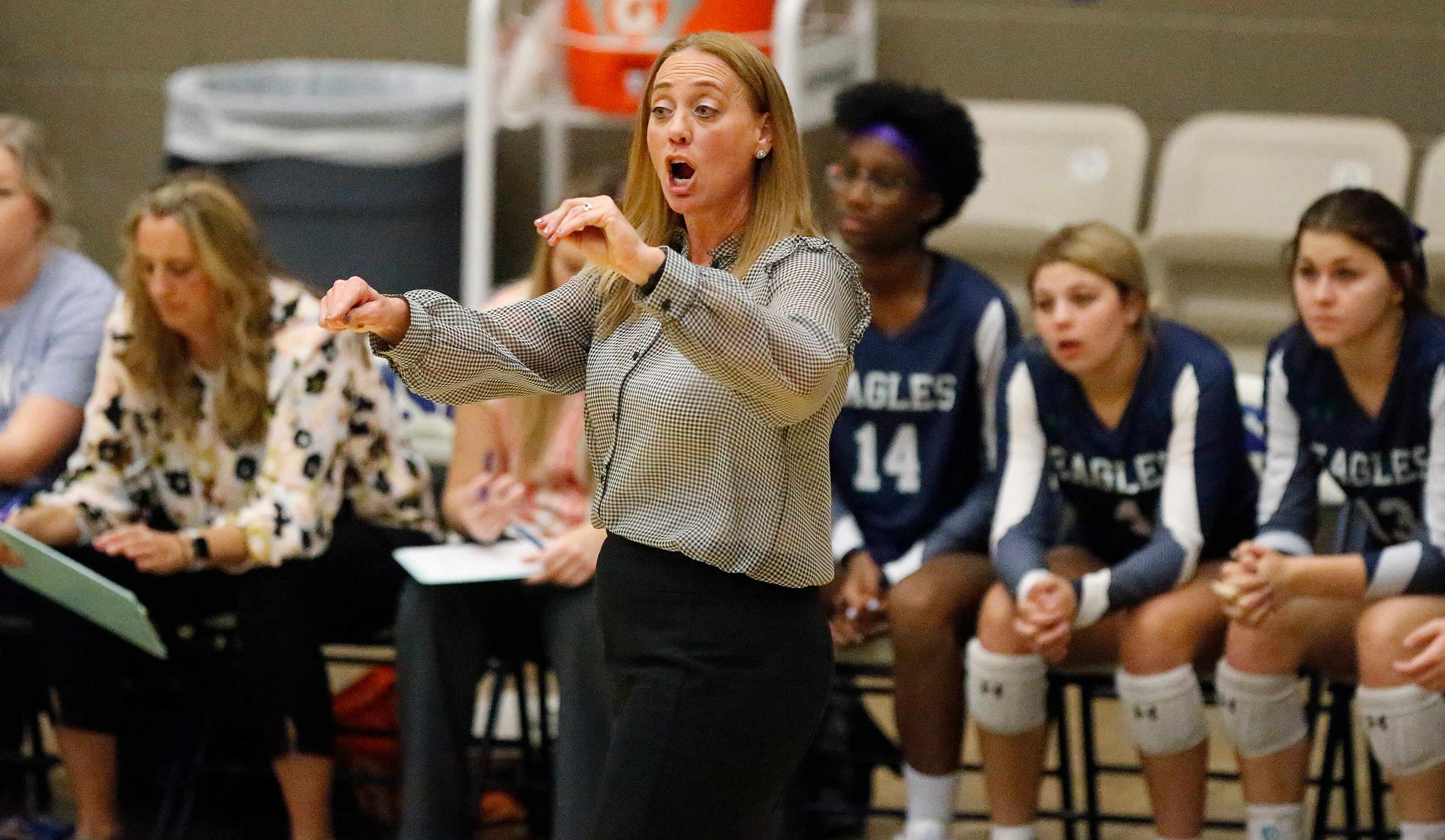 V.R. Eaton High School head coach Diane Wilson encourages her team to communicate during...