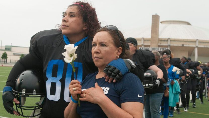 
Estella Carrillo Ramirez, left, a player for the Dallas Elite women's football team, stands...