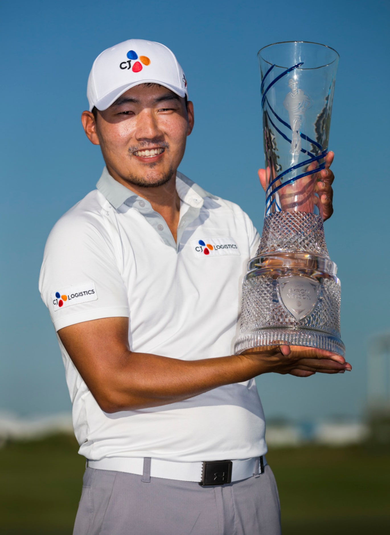 Sung Kang poses with the AT&T Byron Nelson trophy after he won the tournament with a 23...