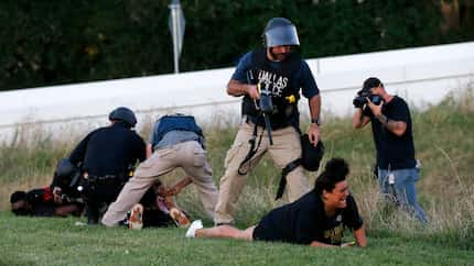 Dallas police Sgt. Roger Rudloff stood over Jantzen Verastique after shooting her with...