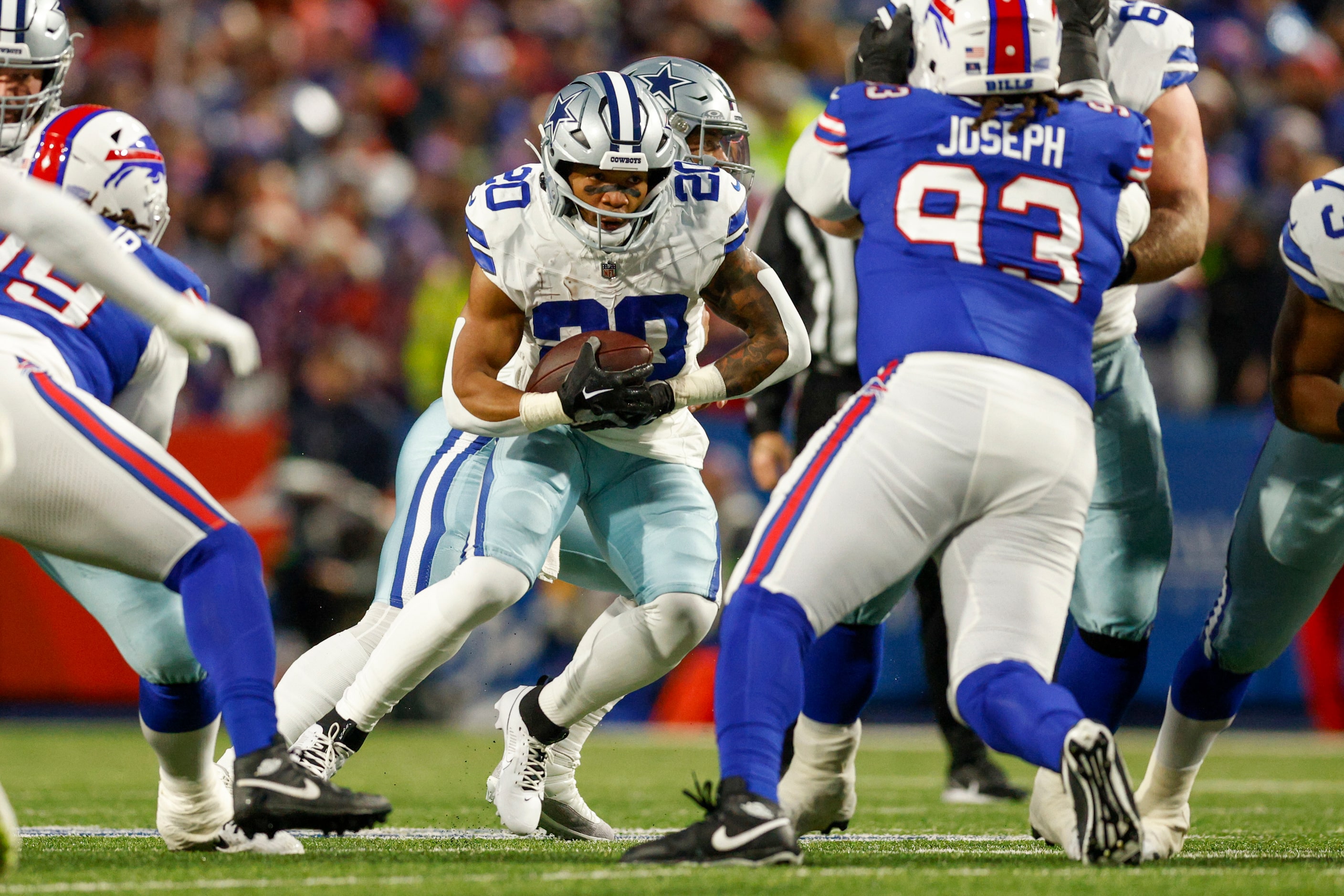 Dallas Cowboys running back Tony Pollard (20) runs the ball through the line during the...