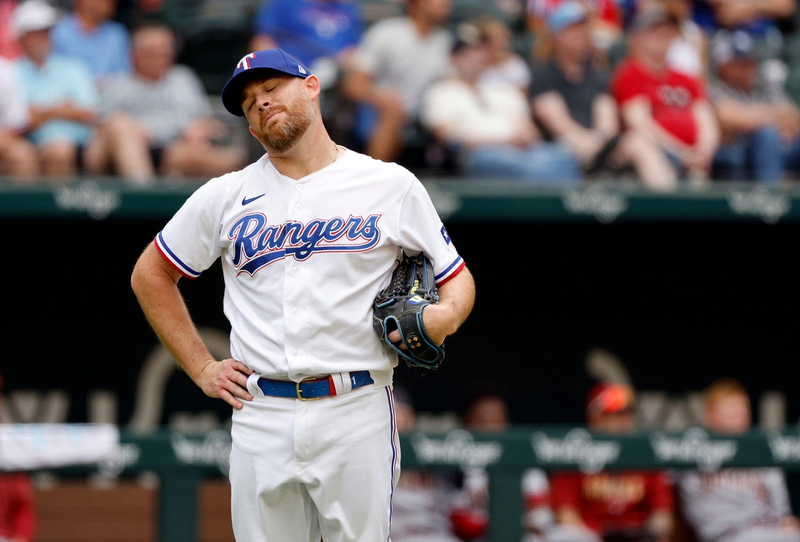 Texas Rangers relief pitcher Ian Kennedy (21) reacts after watching Arizona Diamondbacks...