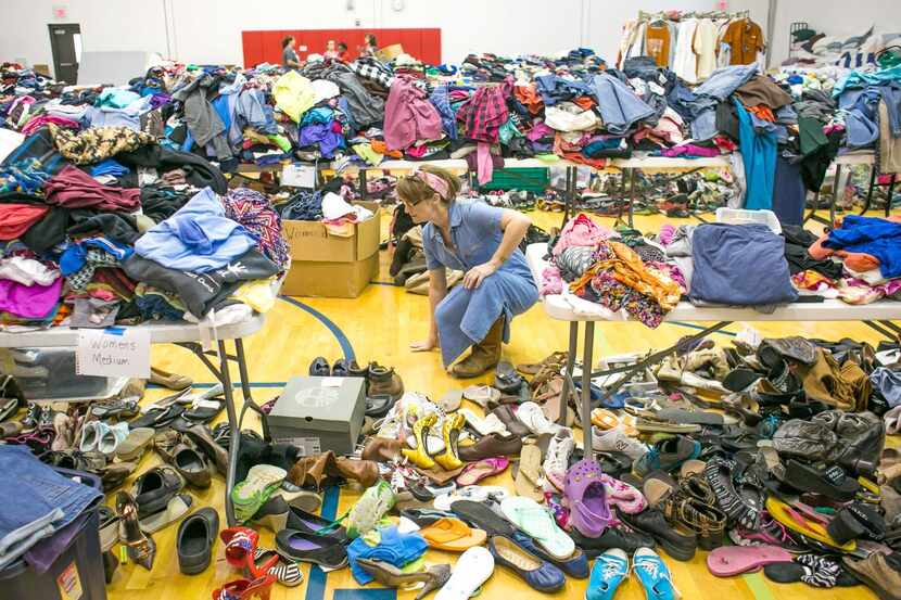 
Melinda Ellisor searched for clothing to give to a family of flood victims during a...