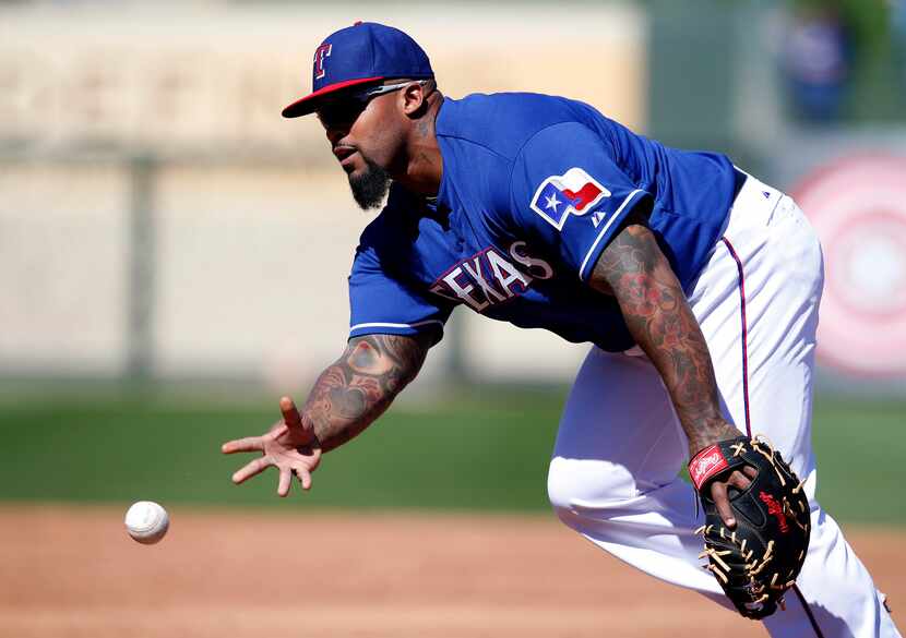 Mar 4, 2015; Surprise, AZ, USA; Texas Rangers first baseman Prince Fielder (84) flips the...