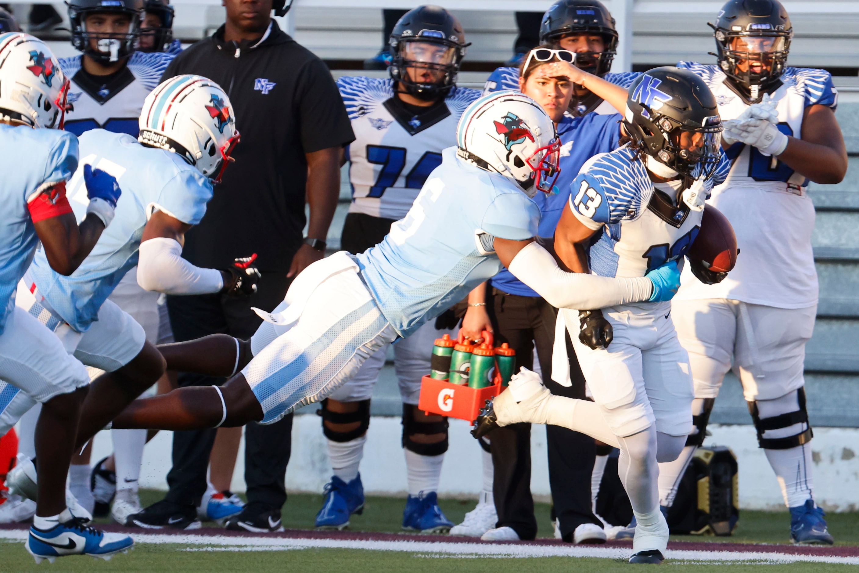 Skyline High’s Rohan Clarkson (left) tackles North Forney High’s Nathan McCoy during the...