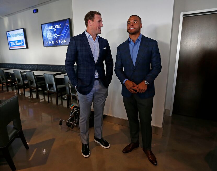 Dallas Cowboys tight end Jason Witten, left, talks with quarterback Dak Prescott at the...