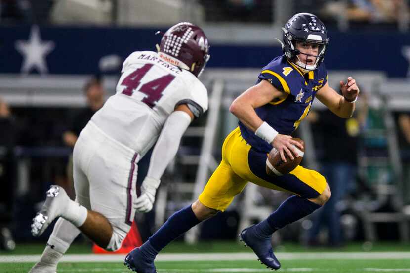 Highland Park quarterback Chandler Morris (4) is threatened by Magnolia defensive lineman...