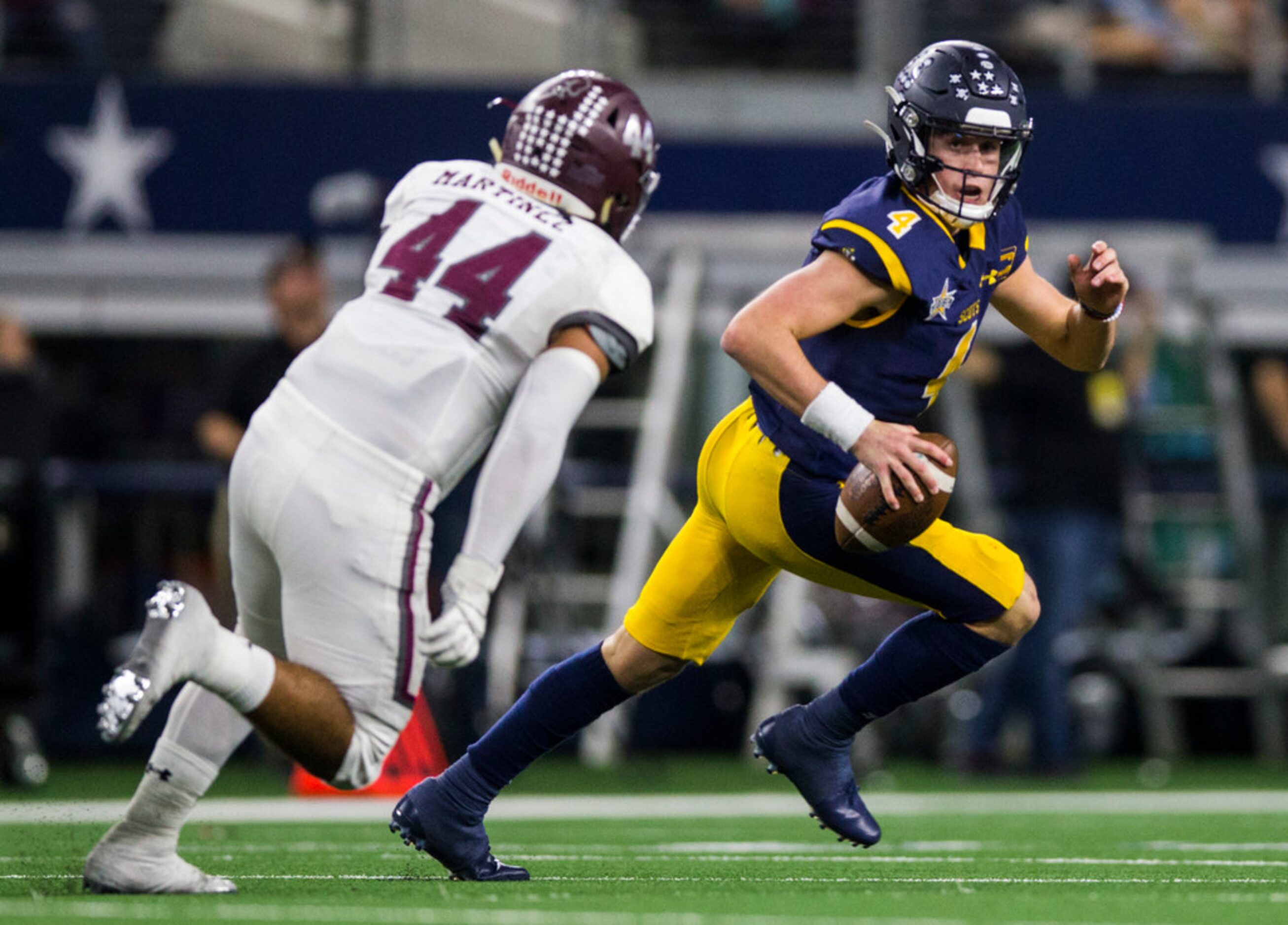 Highland Park quarterback Chandler Morris (4) is threatened by Magnolia defensive lineman...