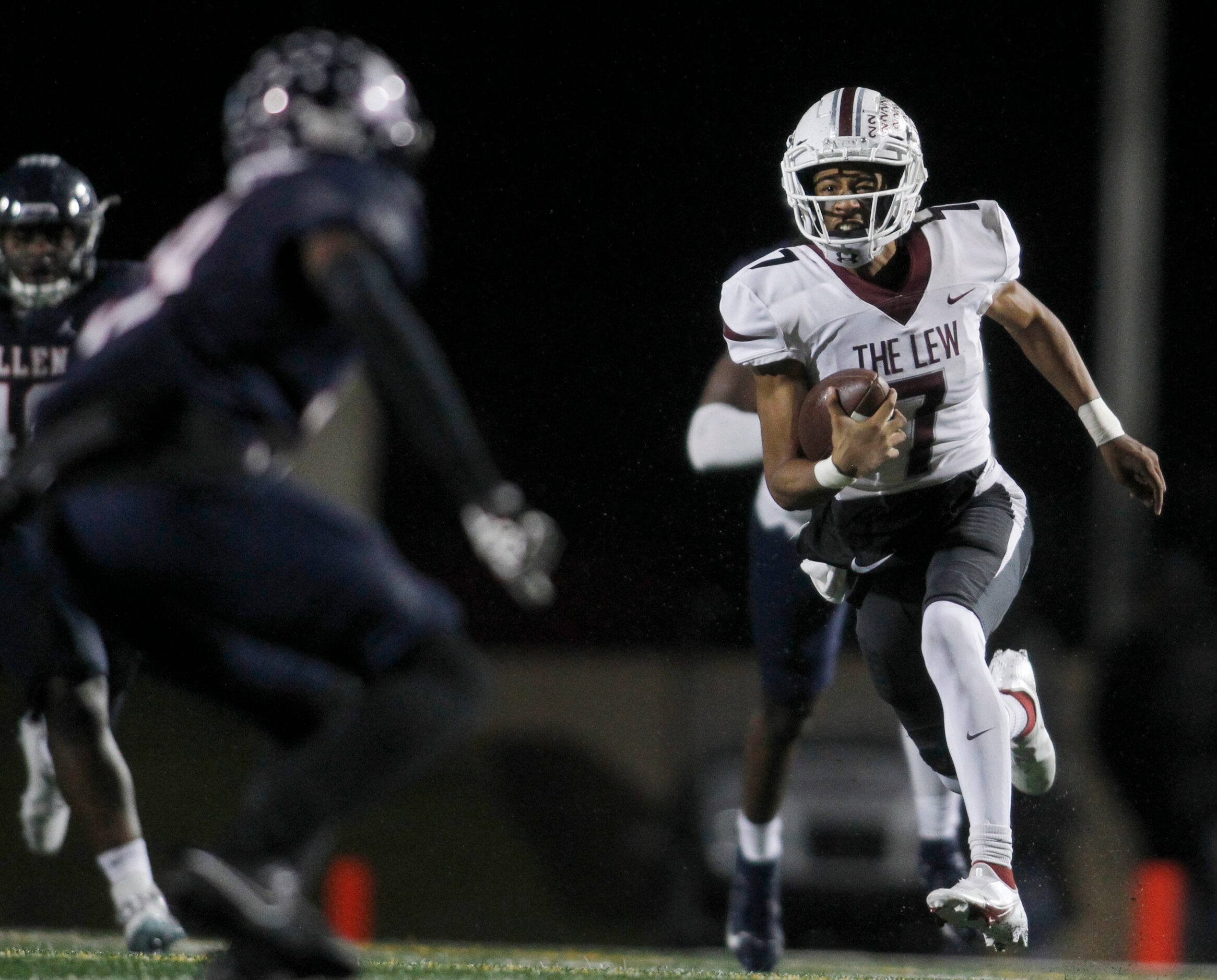 Lewisville quarterback Ethan Terrell (7), right, rushes into the Allen secondary as Eagles...