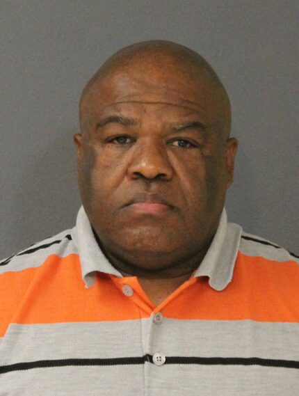 Dallas police officer Reginald Jones turned himself in to DeSoto police on Friday.