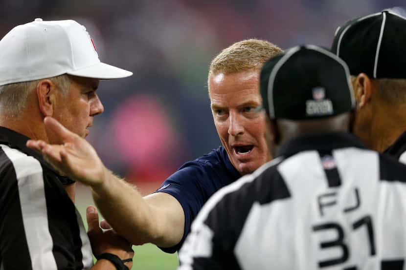 Dallas Cowboys head coach Jason Garrett argues with officials after a defensive stop from...