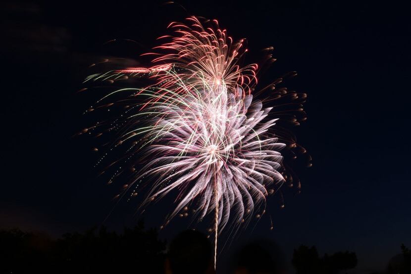 Fourth of July fireworks light up the sky Friday, July 1, 2016, in downtown Flint, Mich....