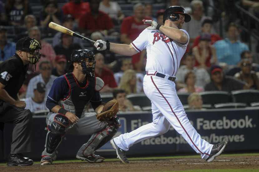 Atlanta Braves catcher Brian McCann (16) hits against the Cleveland Indians a baseball game,...