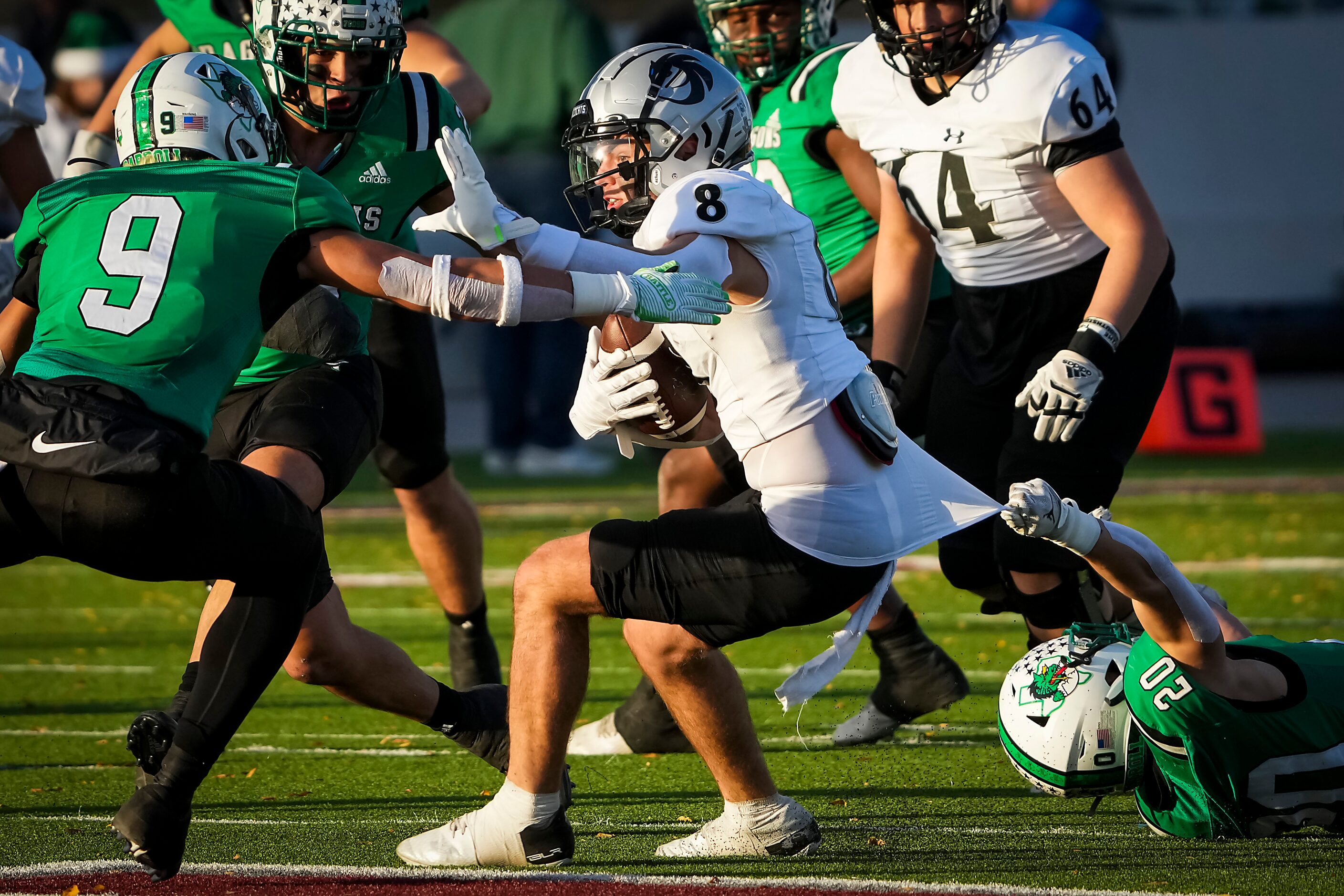 Denton Guyer wide receiver Sutton Lee (8) is brought down by Southlake Carroll defensive...