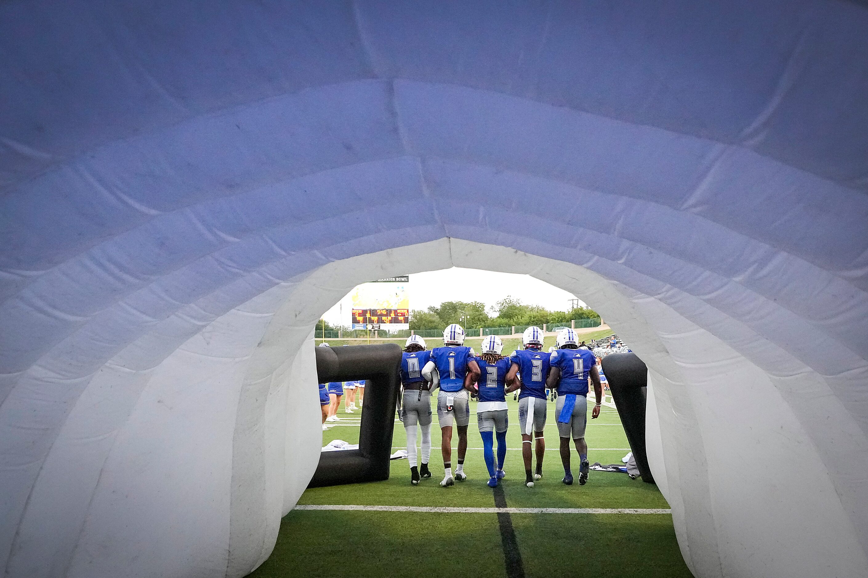 Grand Prairie defensive back Kelton Moore (0), wide receiver Dion McGriff (1), running back...