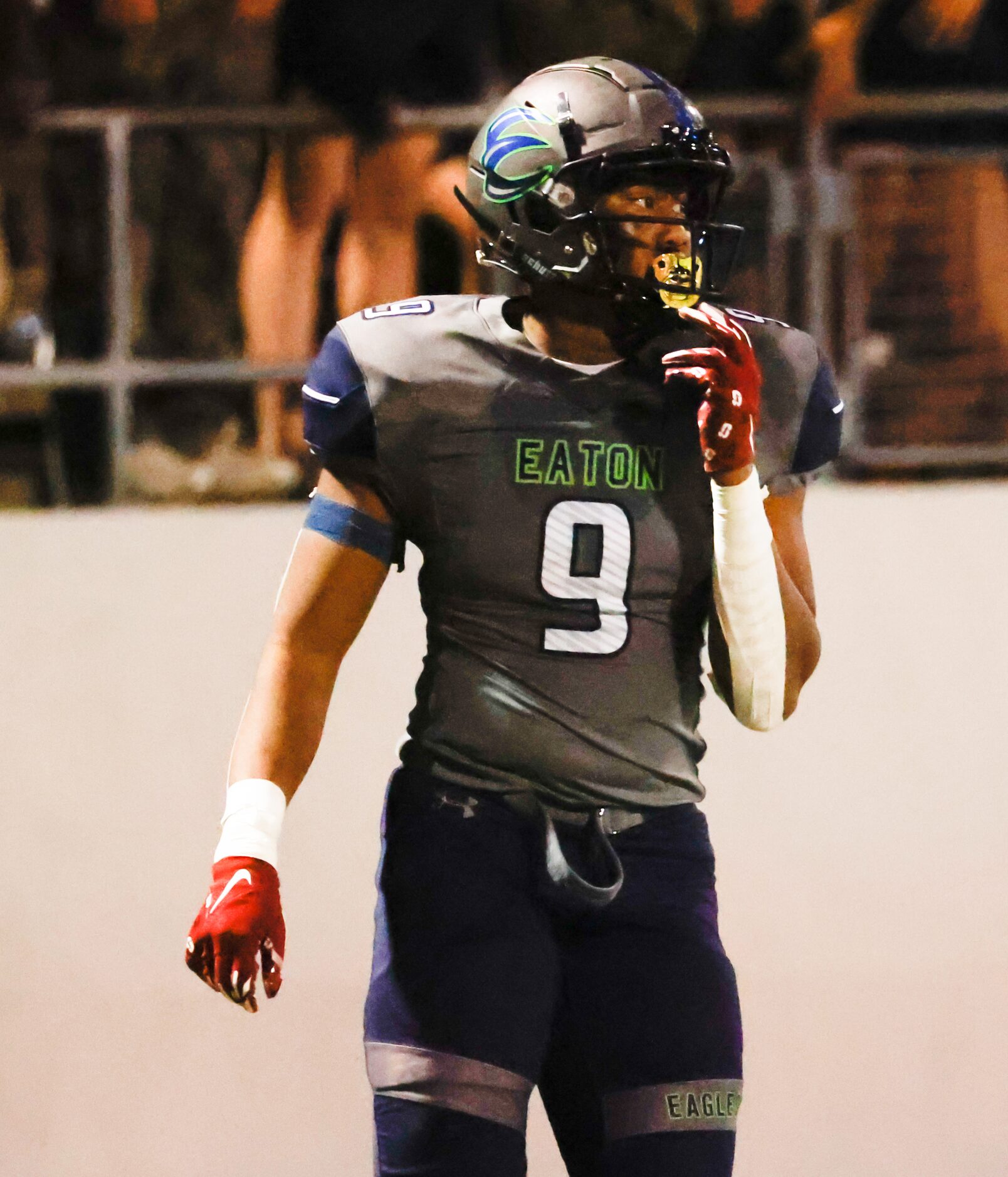 V.R. Eaton High School tight end Jaden Platt (9) moves back into position during the first...