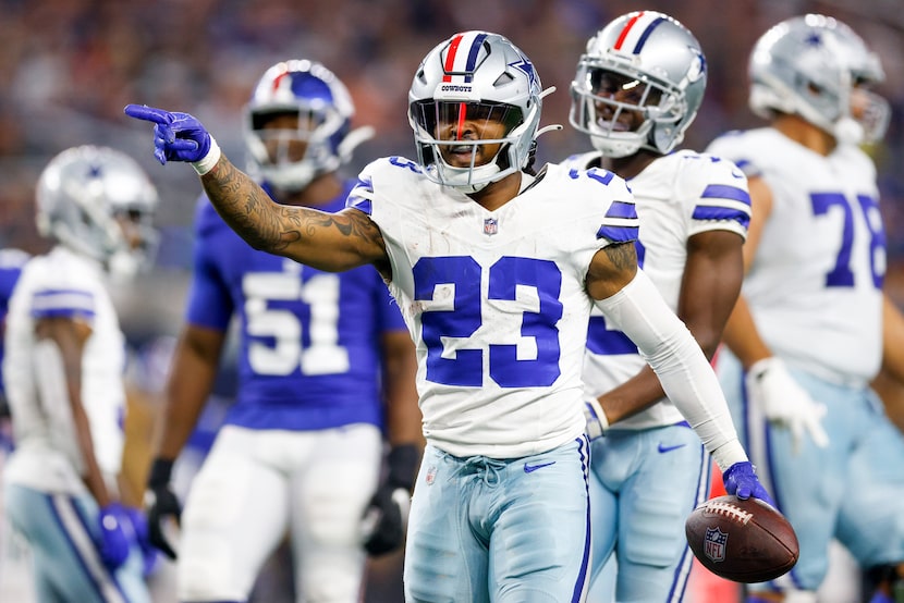 Dallas Cowboys running back Rico Dowdle (23) signals for a first down after a run during the...