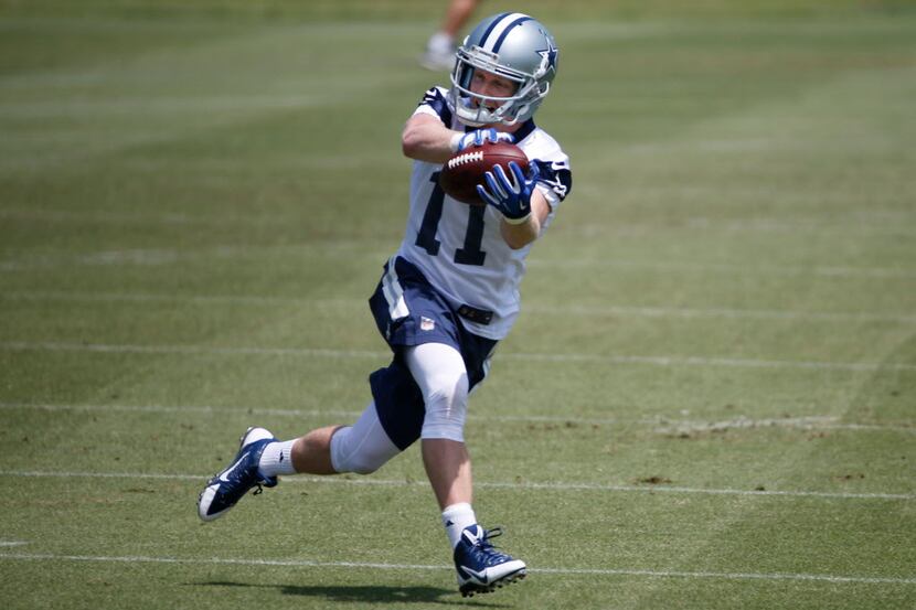 Dallas Cowboys receiver Cole Beasley (11) catches a pass during the teams' OTA workout at...
