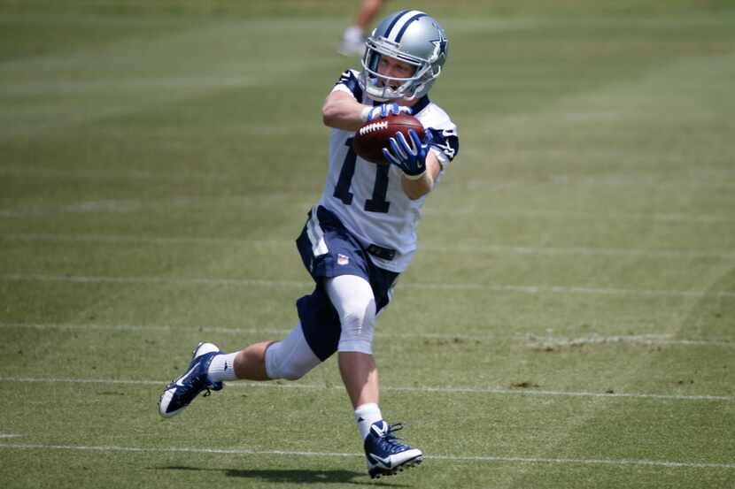 Dallas Cowboys receiver Cole Beasley (11) catches a pass during the teams' OTA workout at...