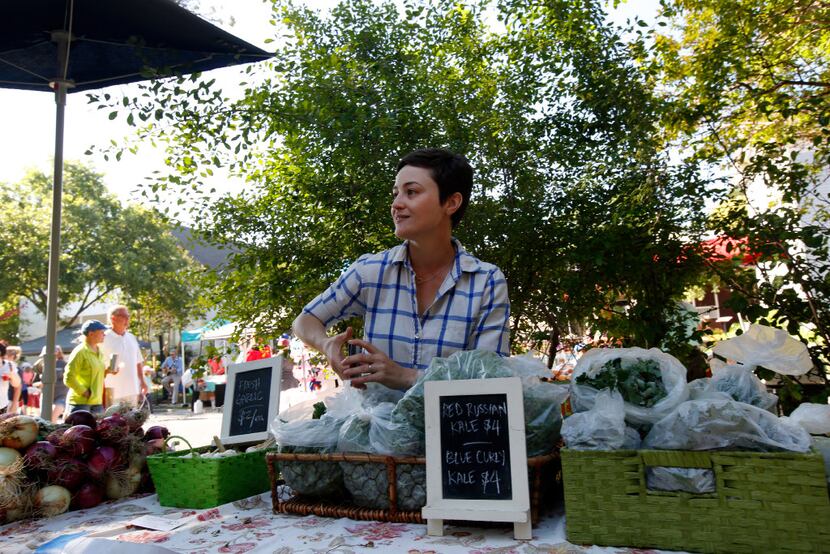 Megan Neubauer of Pure Land Organic sold kale and other produce at the McKinney Farmers...