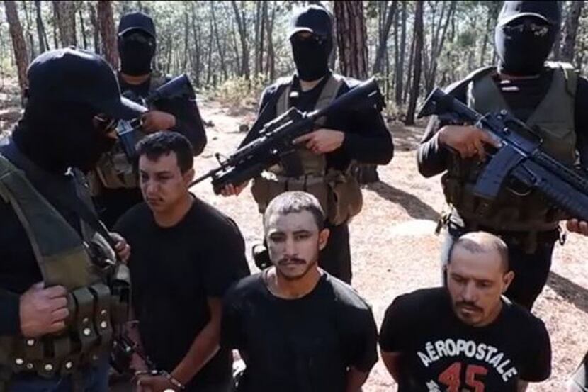  The Jalisco New Generation Cartel posted a video early in 2015 showing masked members of...