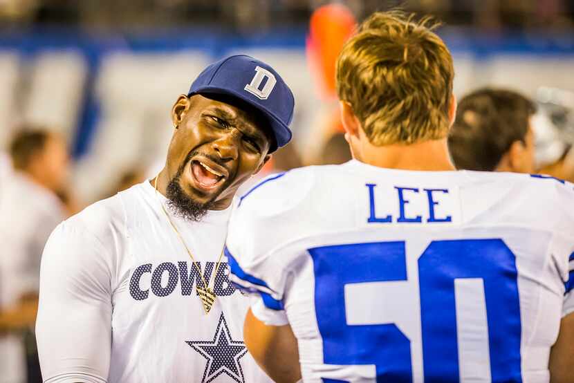 Dallas Cowboys wide receiver Dez Bryant talks with middle linebacker Sean Lee on the...