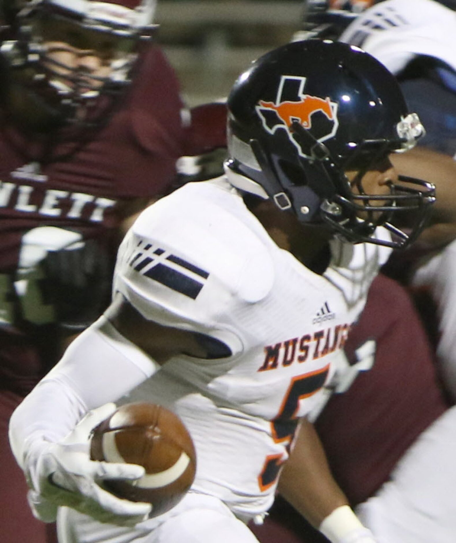 Sachse receiver Devin Duvernay (5) looks for some running room inside during a second...