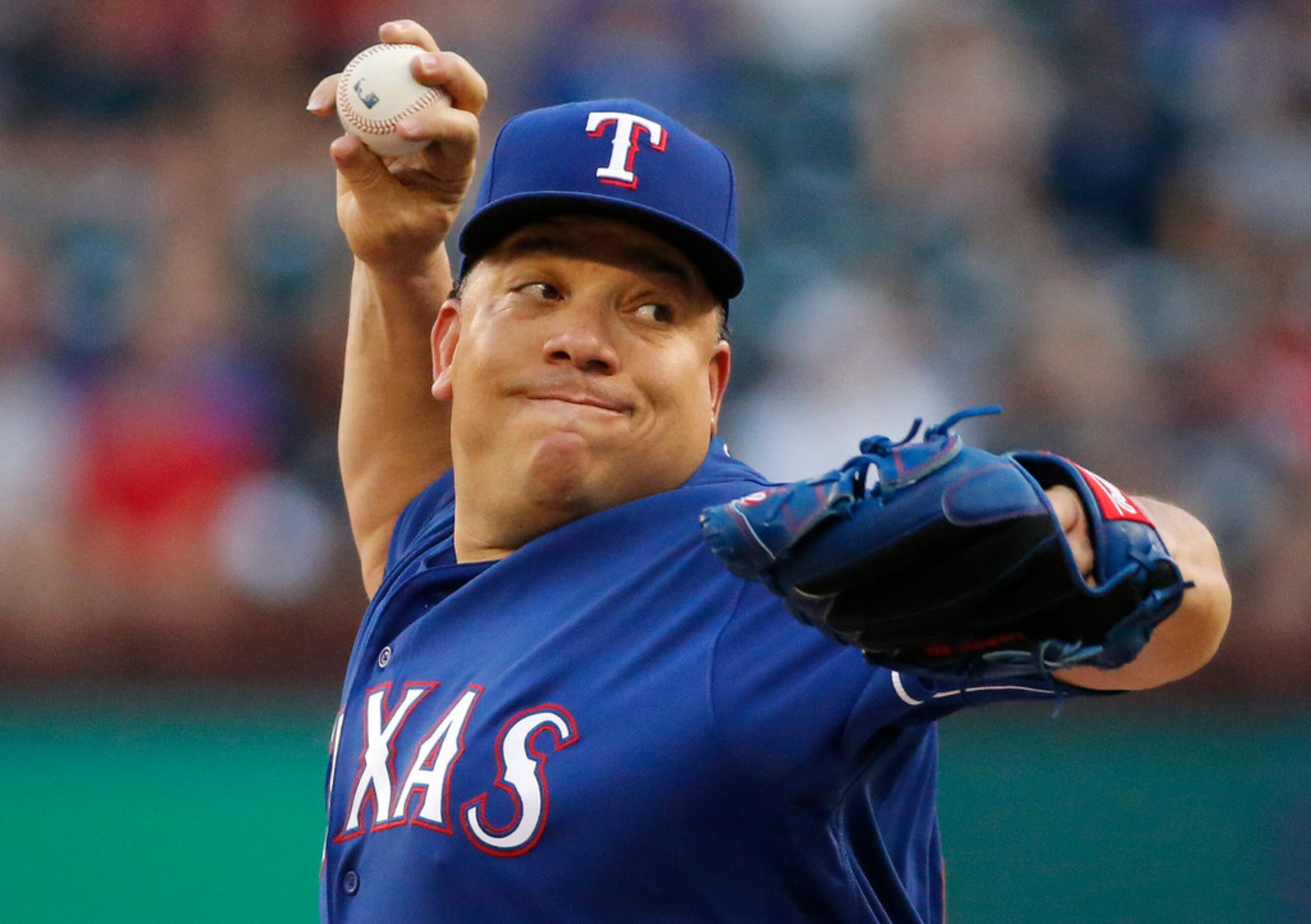 Texas Rangers starting pitcher Bartolo Colon (40) throws a first-inning pitch during the New...