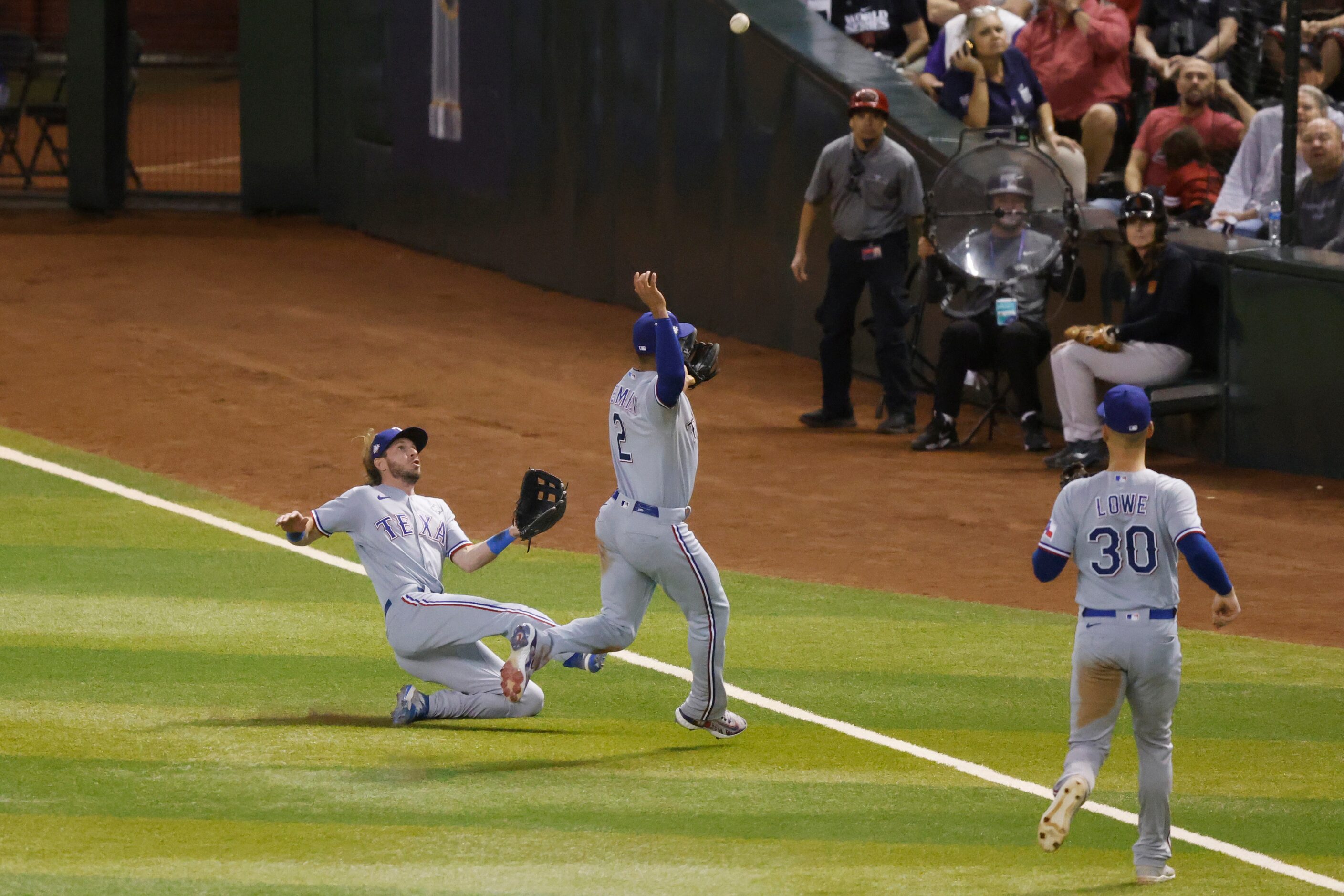 Texas Rangers right fielder Travis Jankowski, left, collides with second baseman Marcus...