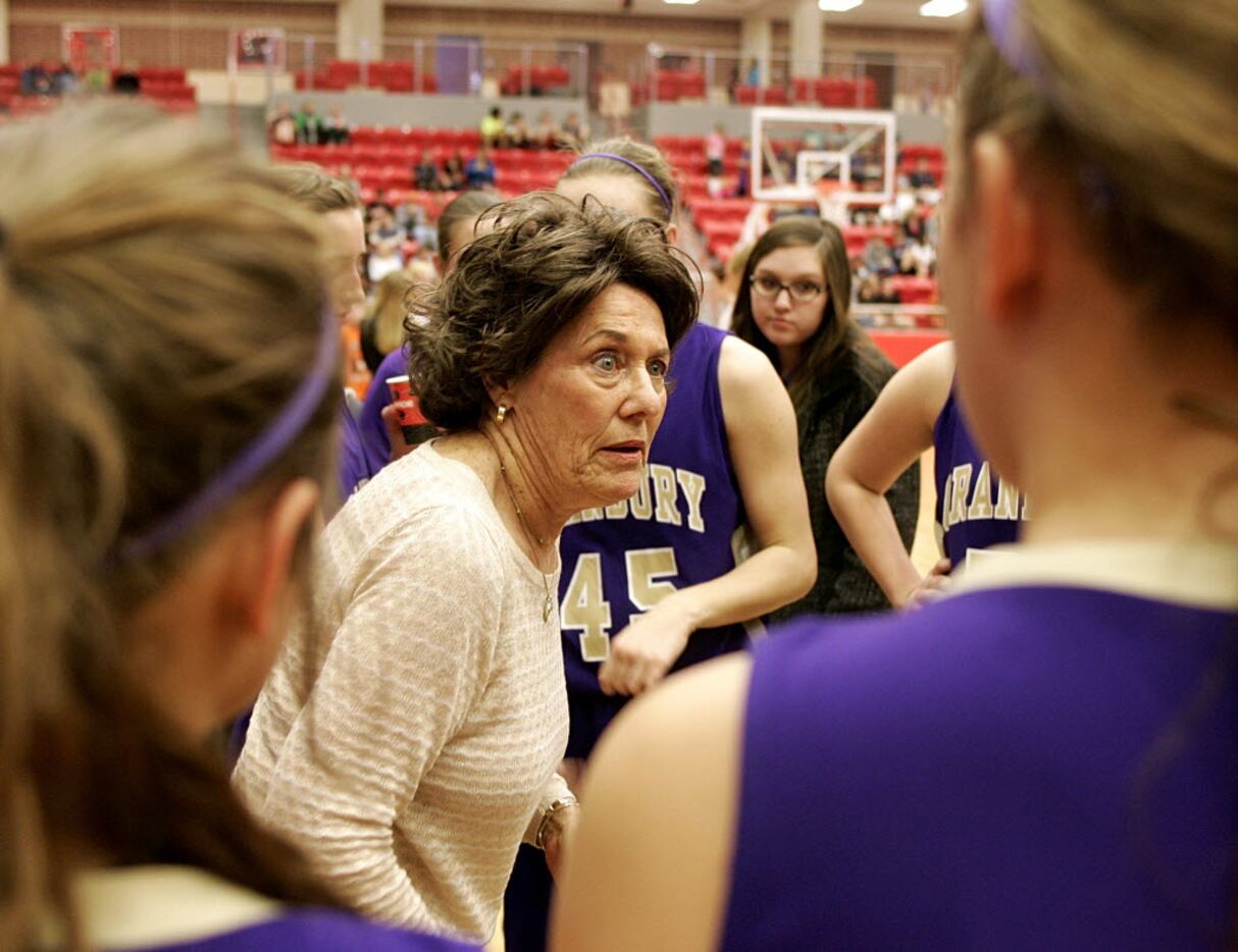 Granbury head coach Leta Andrews talks to the team during a time out as Aledo played...