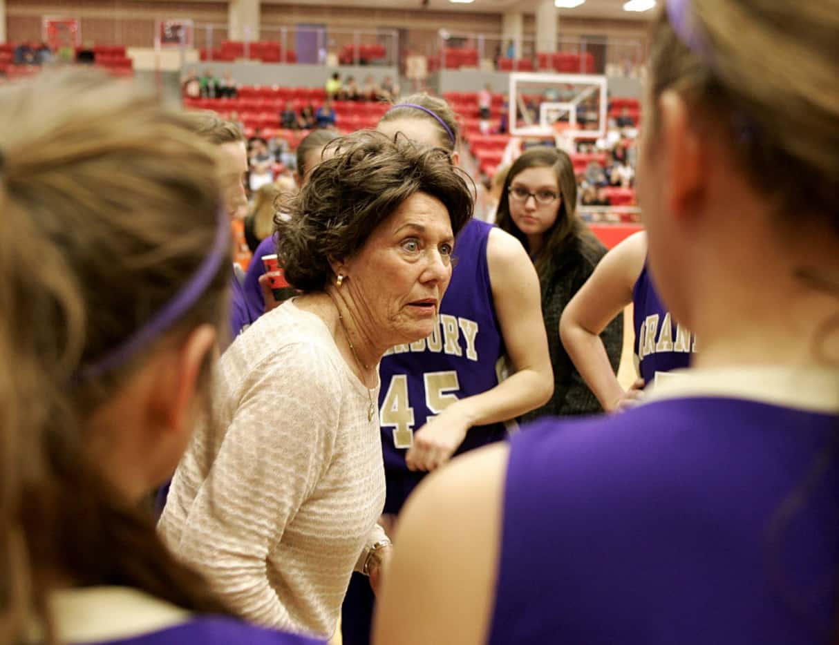 Granbury head coach Leta Andrews talks to the team during a time out as Aledo played...