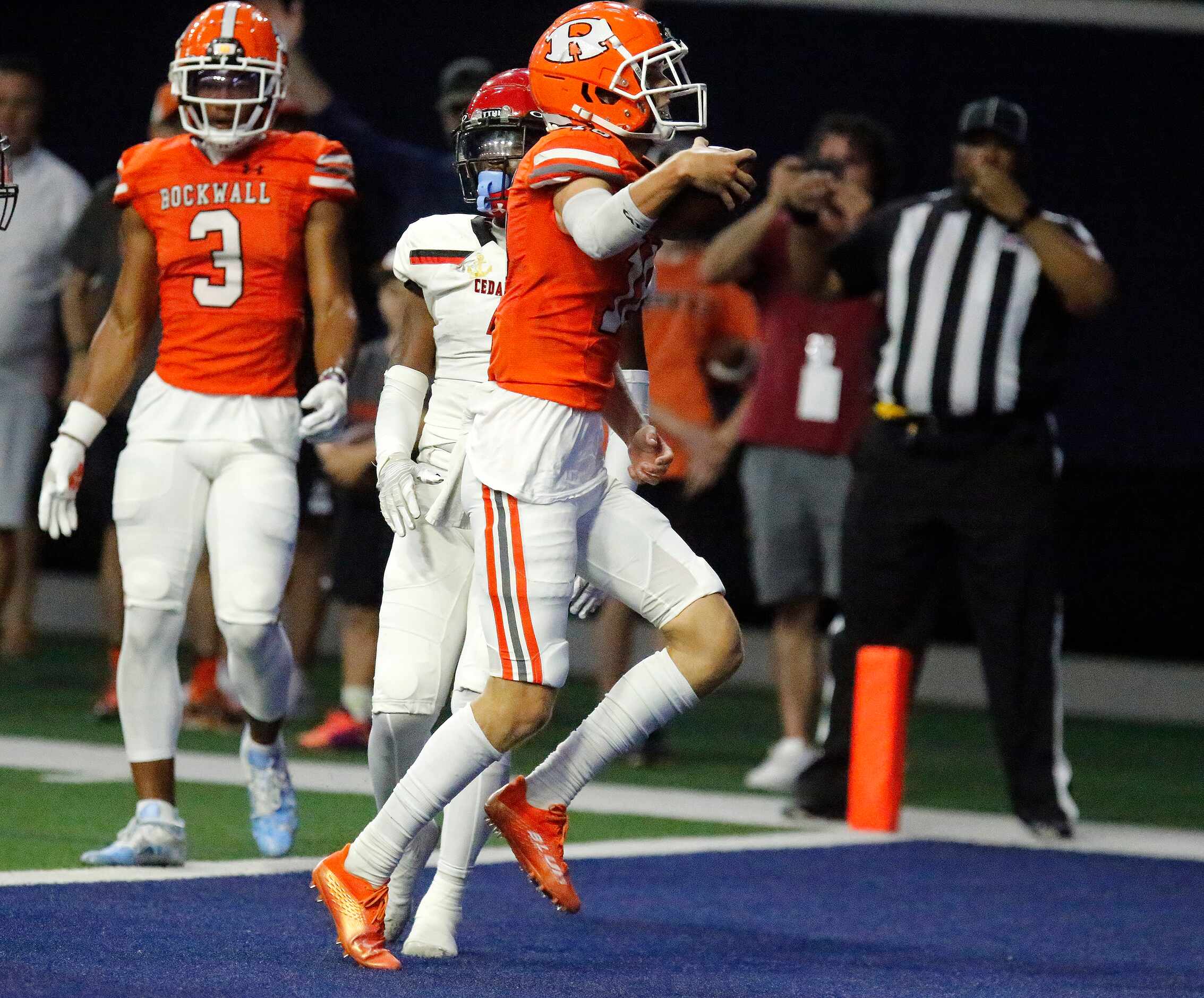 Rockwall High School quarterback Mason Marshall (16) carries the ball in for his third...