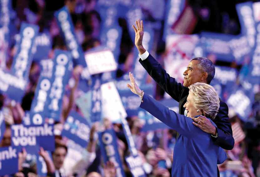 President Barack Obama and Democratic presidential candidate Hillary Clinton waved following...