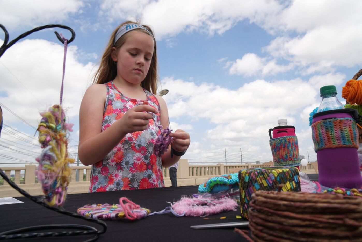 Amelie Guillot (8 years old/cq) makes a yarn Easter egg at the Family Arts Day at on the...