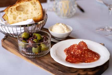 All diners get focaccia, top, with whipped ricotta, olives and sliced meat at Monarch.