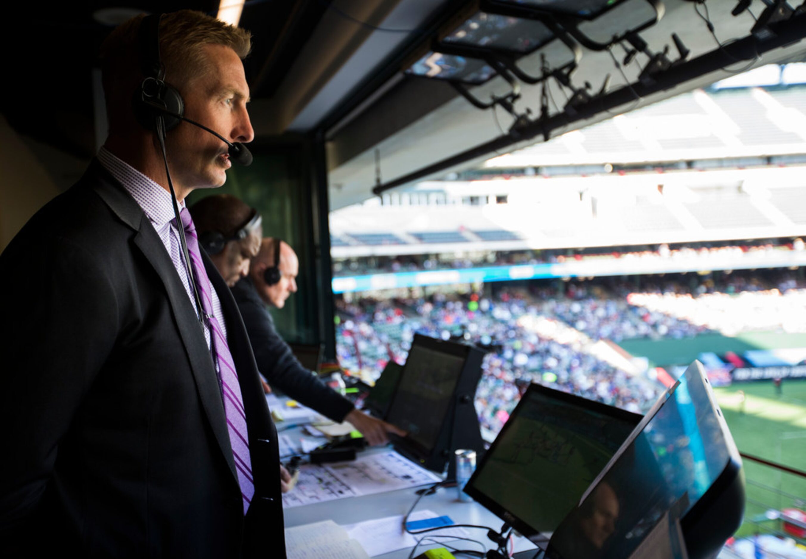 FOX Sports broadcaster Joel Klatt (left) calls an XFL game between the Dallas Renegades and...