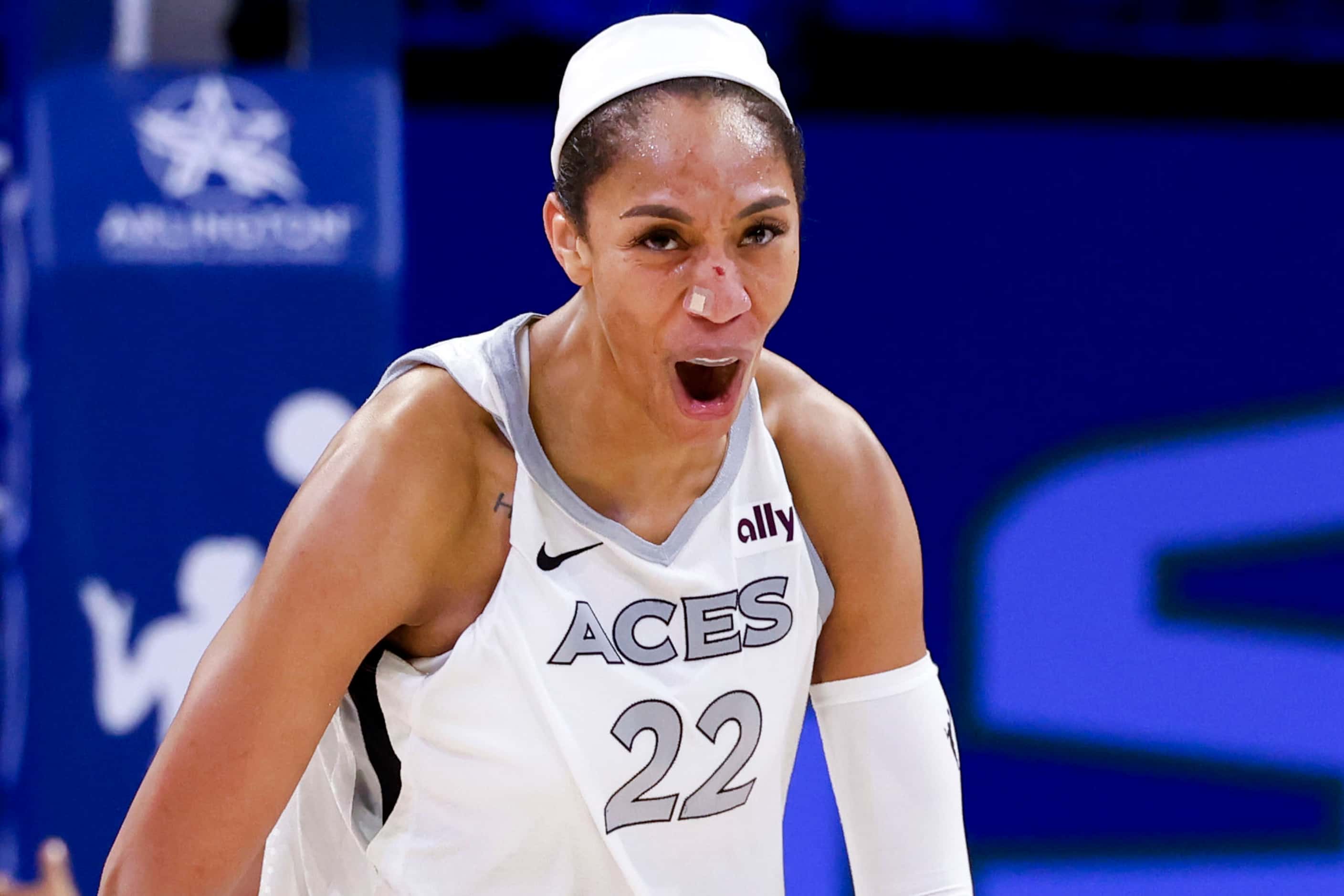 Las Vegas Aces center A'ja Wilson reacts after scoring from a three-pointer against the...