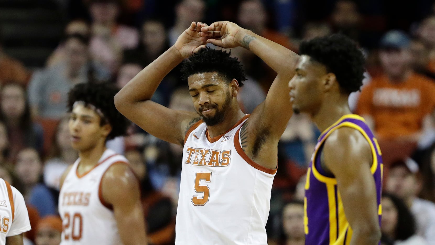 Texas forward Royce Hamm Jr. (5) reacts after he was called for a foul during the second...