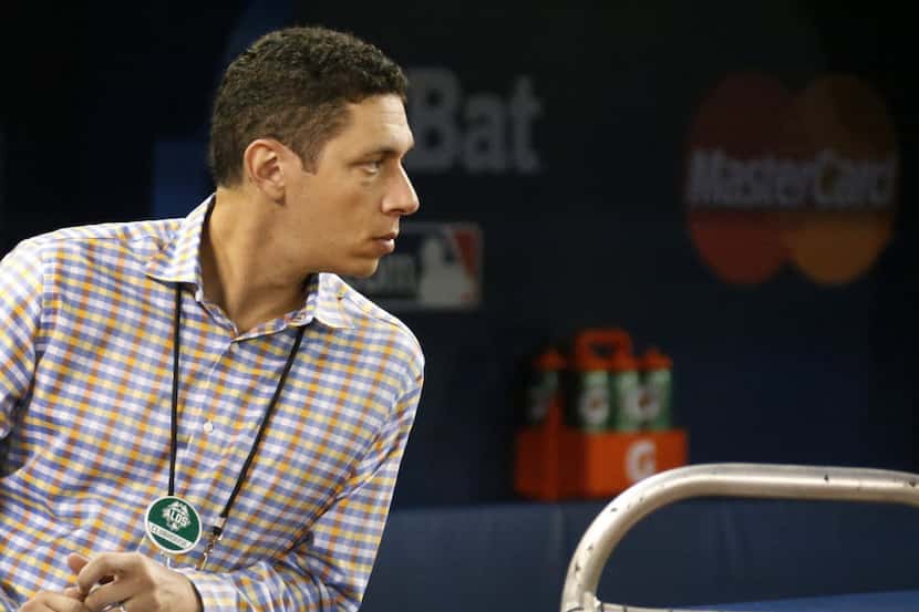 Texas general manager Jon Daniels watches the action during batting practice before Game 5...