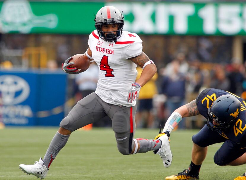 MORGANTOWN, WV - NOVEMBER 07:  Justin Stockton #4 of the Texas Tech Red Raiders rushes...